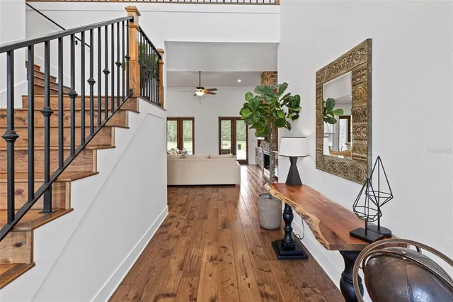 a view of entryway with wooden floor