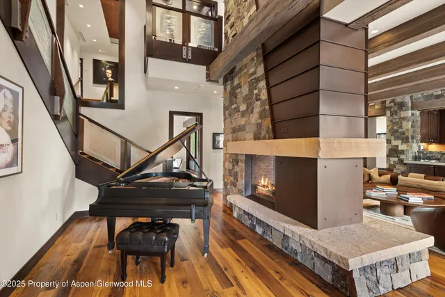 a large white bed in a room next to a window
