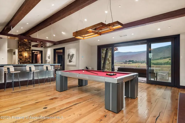 a bathroom with a tub shower and sink