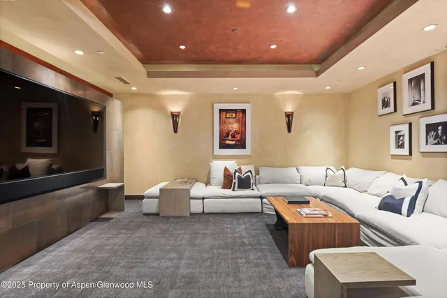 a bedroom with furniture and a large window