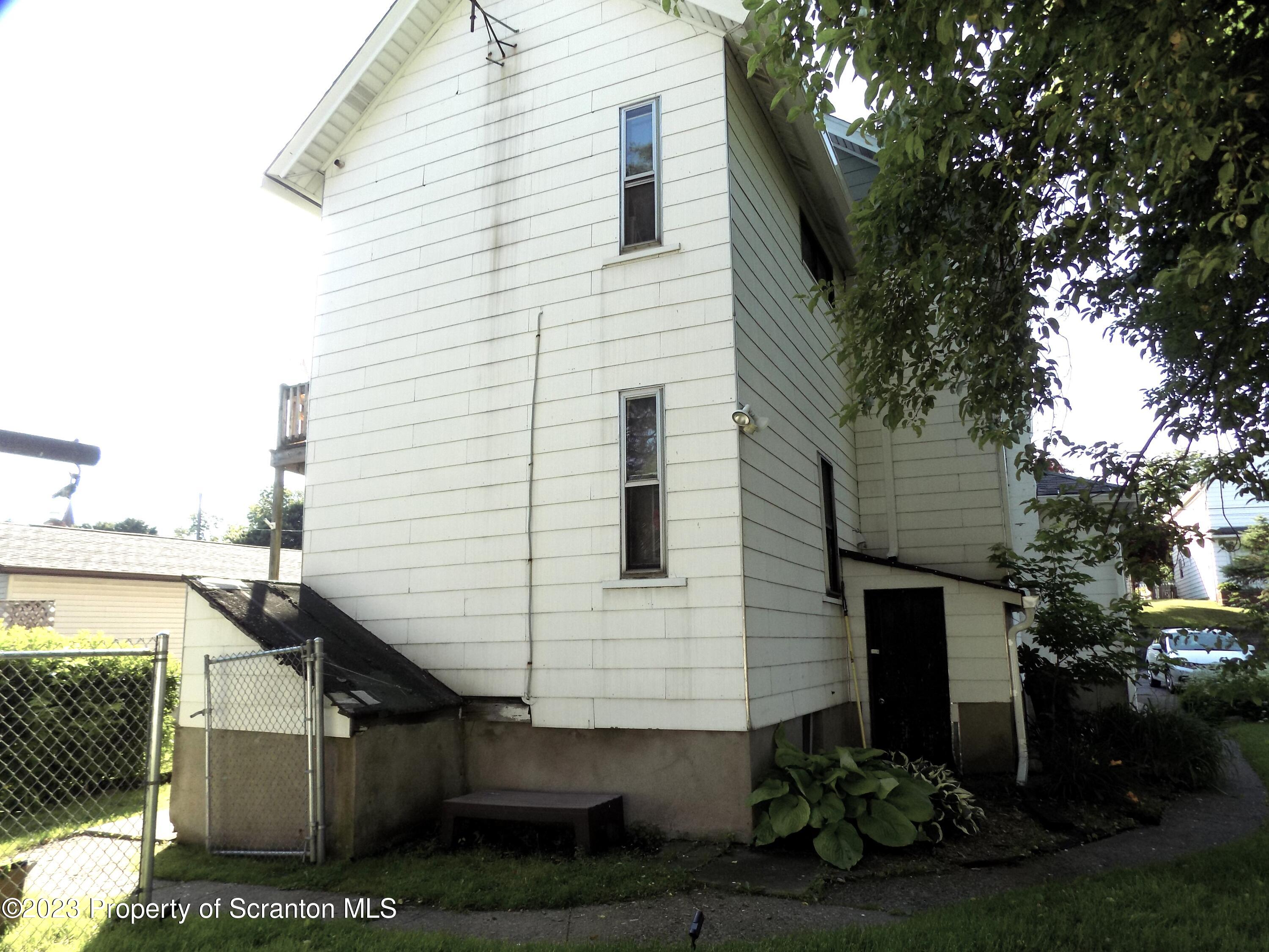 137 Pine Street, Unit 1 Throop, PA 18512 - Photo 14 of 16 a view of a house with a yard