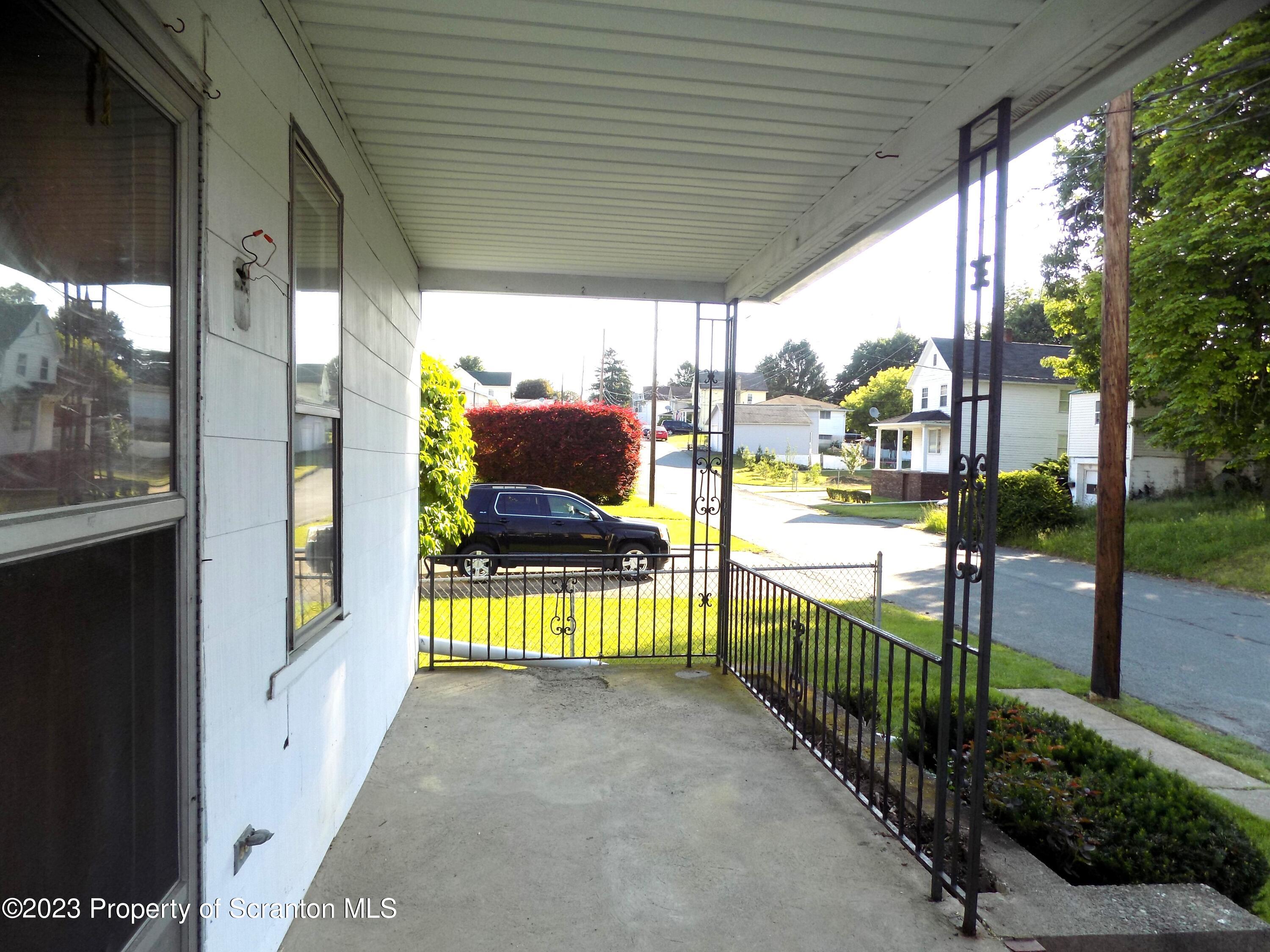 137 Pine Street, Unit 1 Throop, PA 18512 - Photo 2 of 16 a view of railway station with sitting area