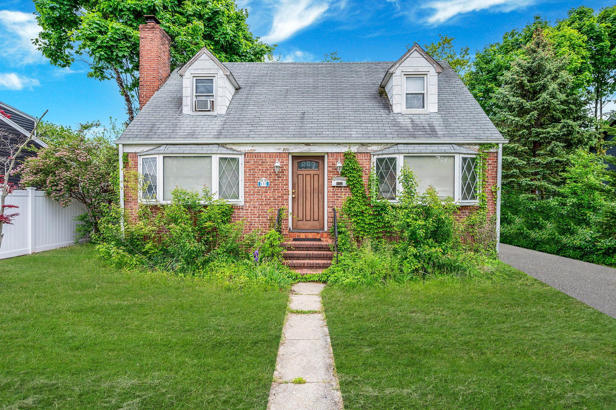 133 County Line Road Amityville, NY 11701 - Photo 1 of 1 a front view of a house with garden
