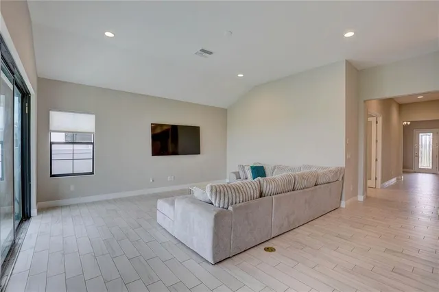 a view of a dining room with furniture and chandelier