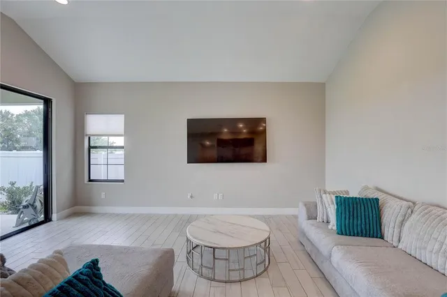 a kitchen with stainless steel appliances kitchen island granite countertop a table and chairs