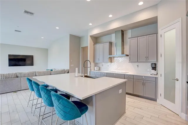 a kitchen with stainless steel appliances white cabinets and a sink