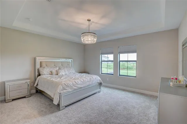 a view of walk in closet with clothes