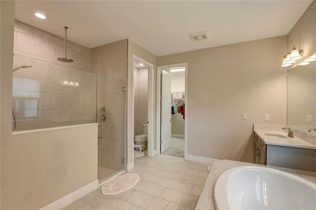 a bathroom with a sink vanity granite and a mirror