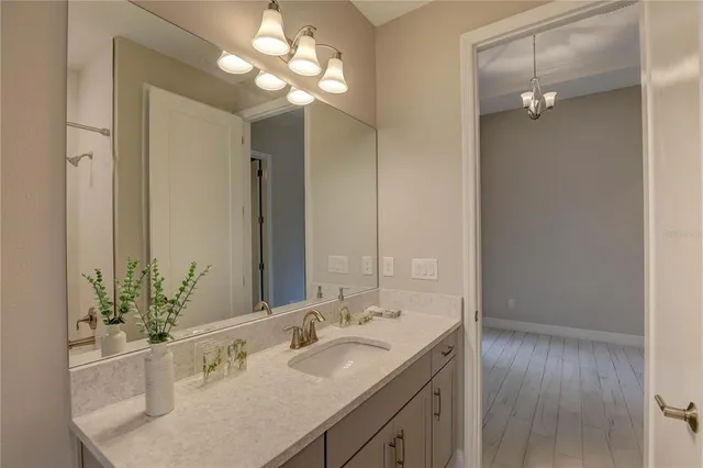 a view of empty room with wooden floor and cabinet