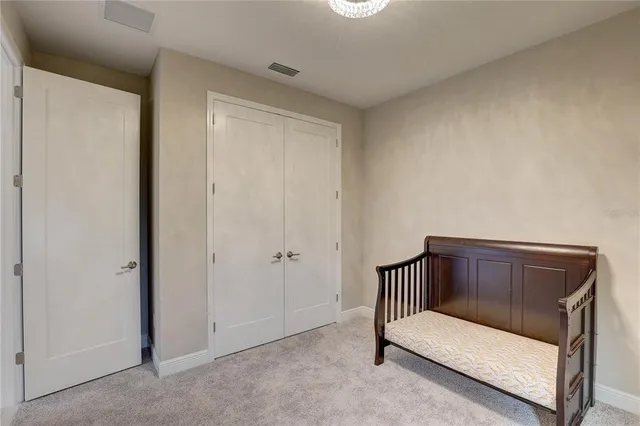 a view of a chandelier in big room and chandelier fan