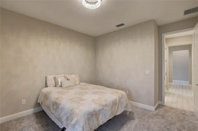 a living room with a bed and a window