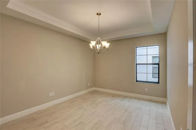 a view of a chair and table in backyard