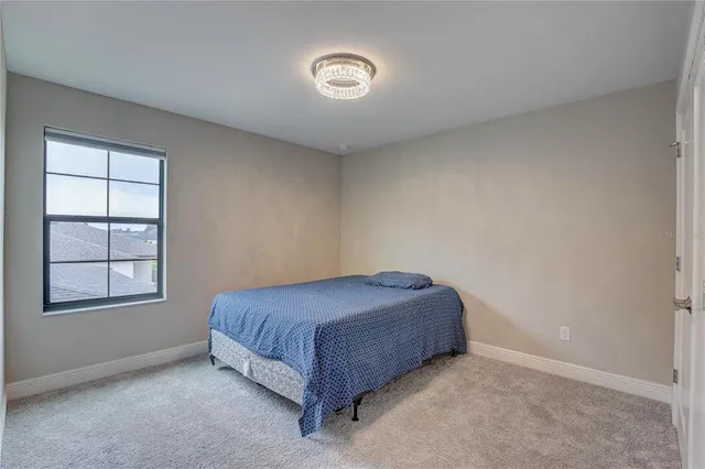 an aerial view of a city with a lake