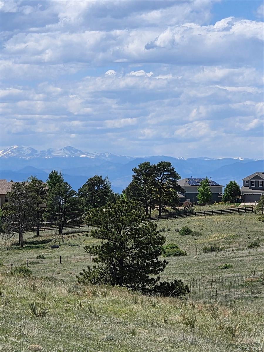 Forest Rim Road Aurora, CO 80016 - Photo 1 of 15 a view of a field with trees in the background