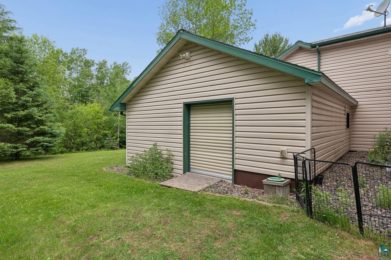 202 Prentice Heights Road Ashland, WI 54806 - Photo 22 of 28 Detached outbuilding with horizontal siding and a green-trimmed gable roof