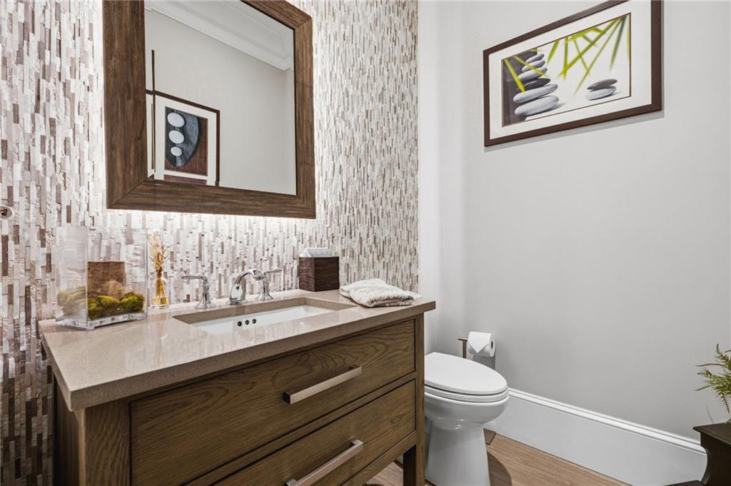 263 Hanson Way Northwest Marietta, GA 30064 - Photo 11 of 84 a bathroom with a granite countertop toilet sink and mirror