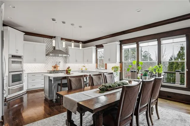 a bath tub sitting in a bathroom next to a window
