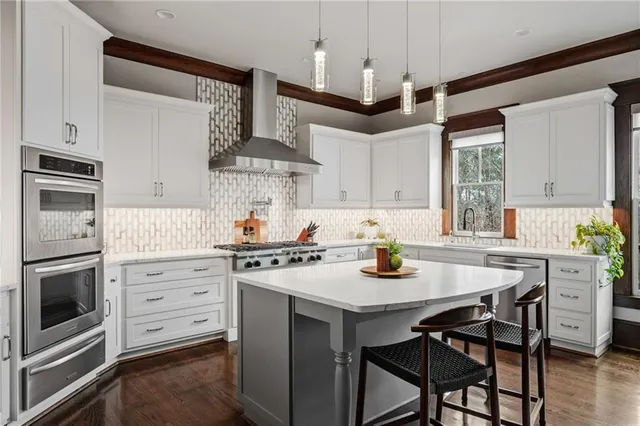 a spacious bathroom with a granite countertop double vanity sink and a mirror