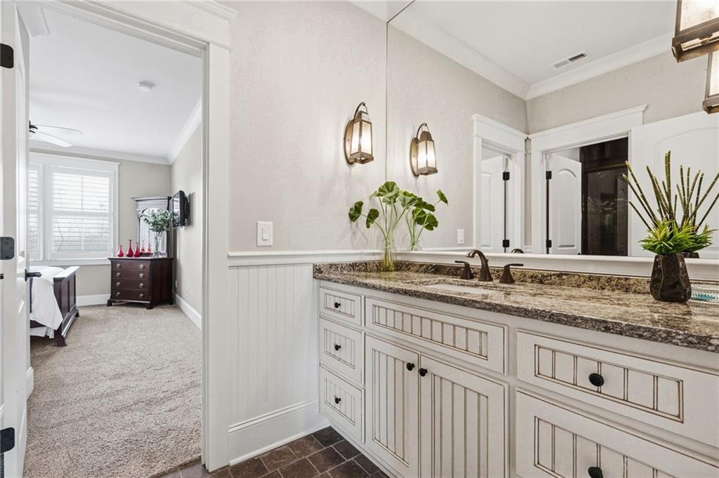263 Hanson Way Northwest Marietta, GA 30064 - Photo 39 of 84 a bathroom with a granite countertop sink and a mirror