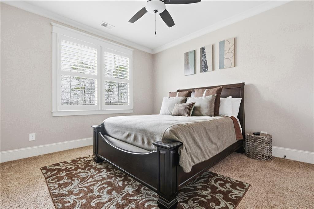 263 Hanson Way Northwest Marietta, GA 30064 - Photo 41 of 84 a bed sitting in a bedroom next to a window