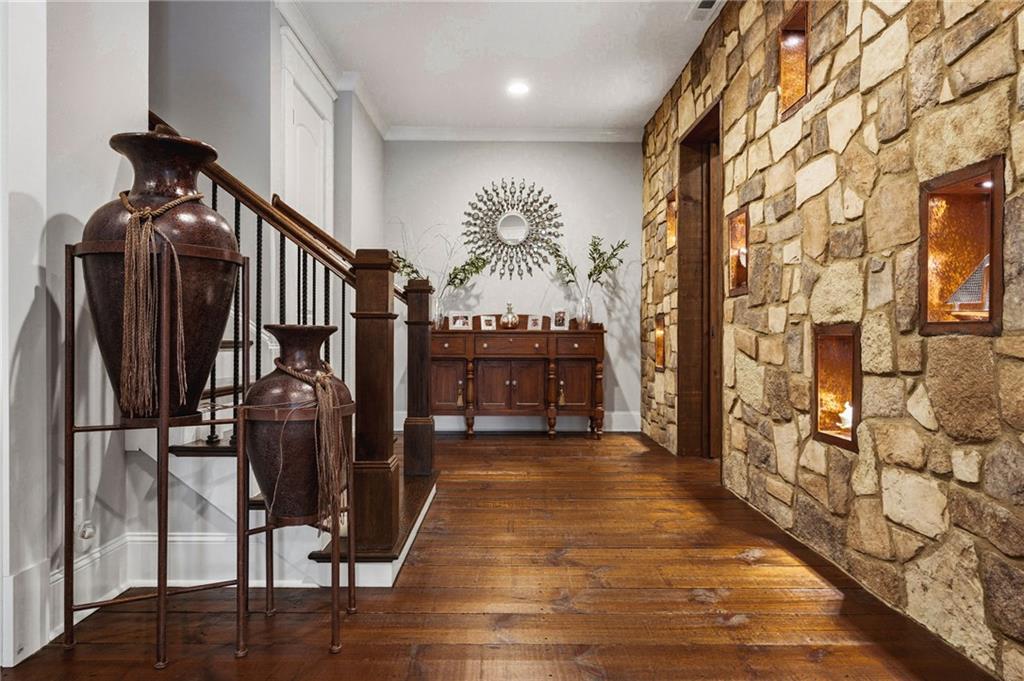 263 Hanson Way Northwest Marietta, GA 30064 - Photo 44 of 84 a view of a hallway with wooden floor and staircase