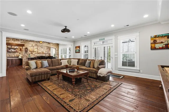 a view of a lake with couches under an umbrella