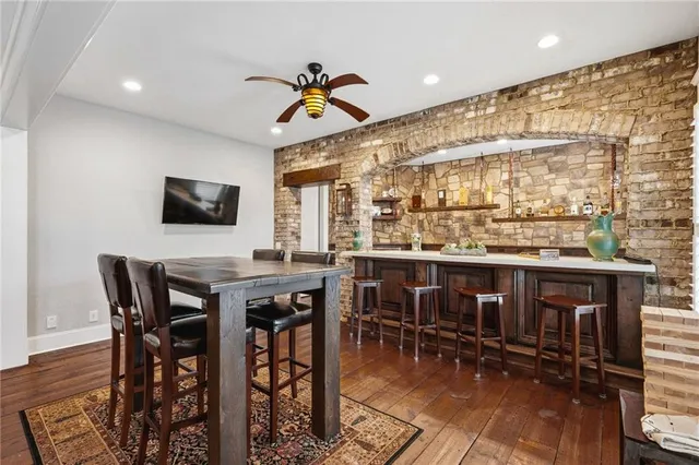 a view of a swimming pool with an outdoor space and seating area