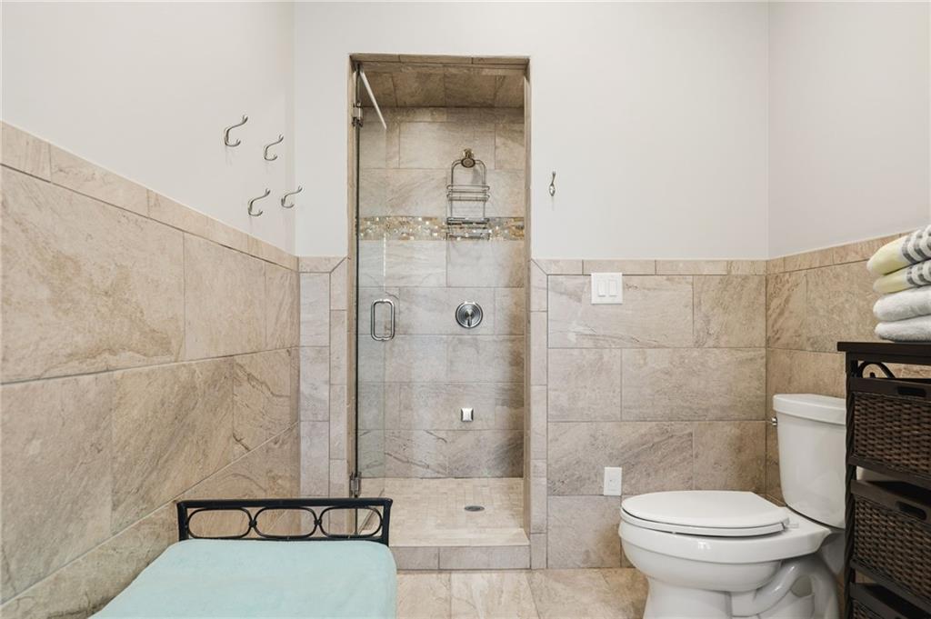 263 Hanson Way Northwest Marietta, GA 30064 - Photo 62 of 84 a bathroom with a toilet and a shower