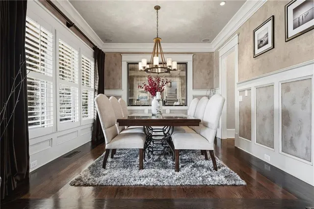a living room with lots of furniture and a table