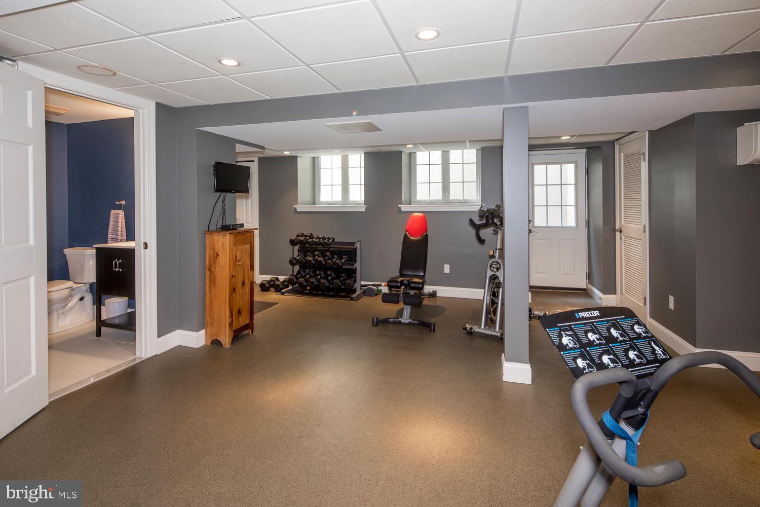200 Glenn Road Ardmore, PA 19003 - Photo 40 of 49 Basement Gym Area, Full Bathroom, and door outside