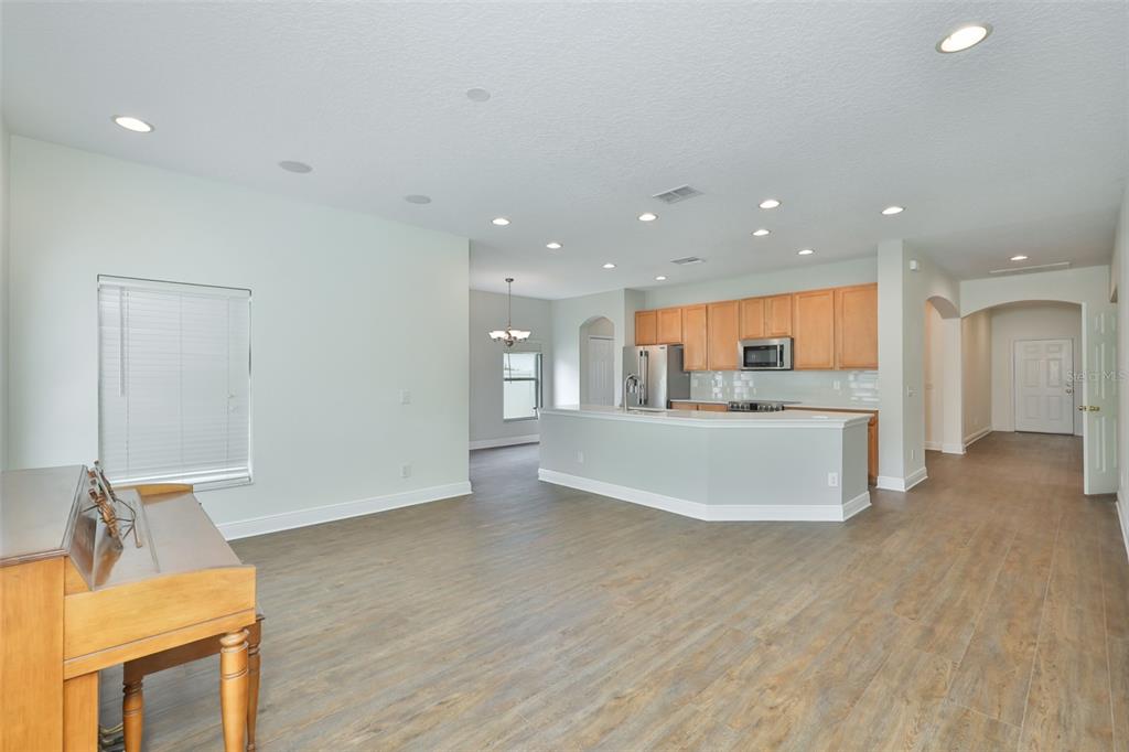 708 Coade Stone Drive Seffner, FL 33584 - Photo 5 of 48 a view of a kitchen with a sink and a refrigerator