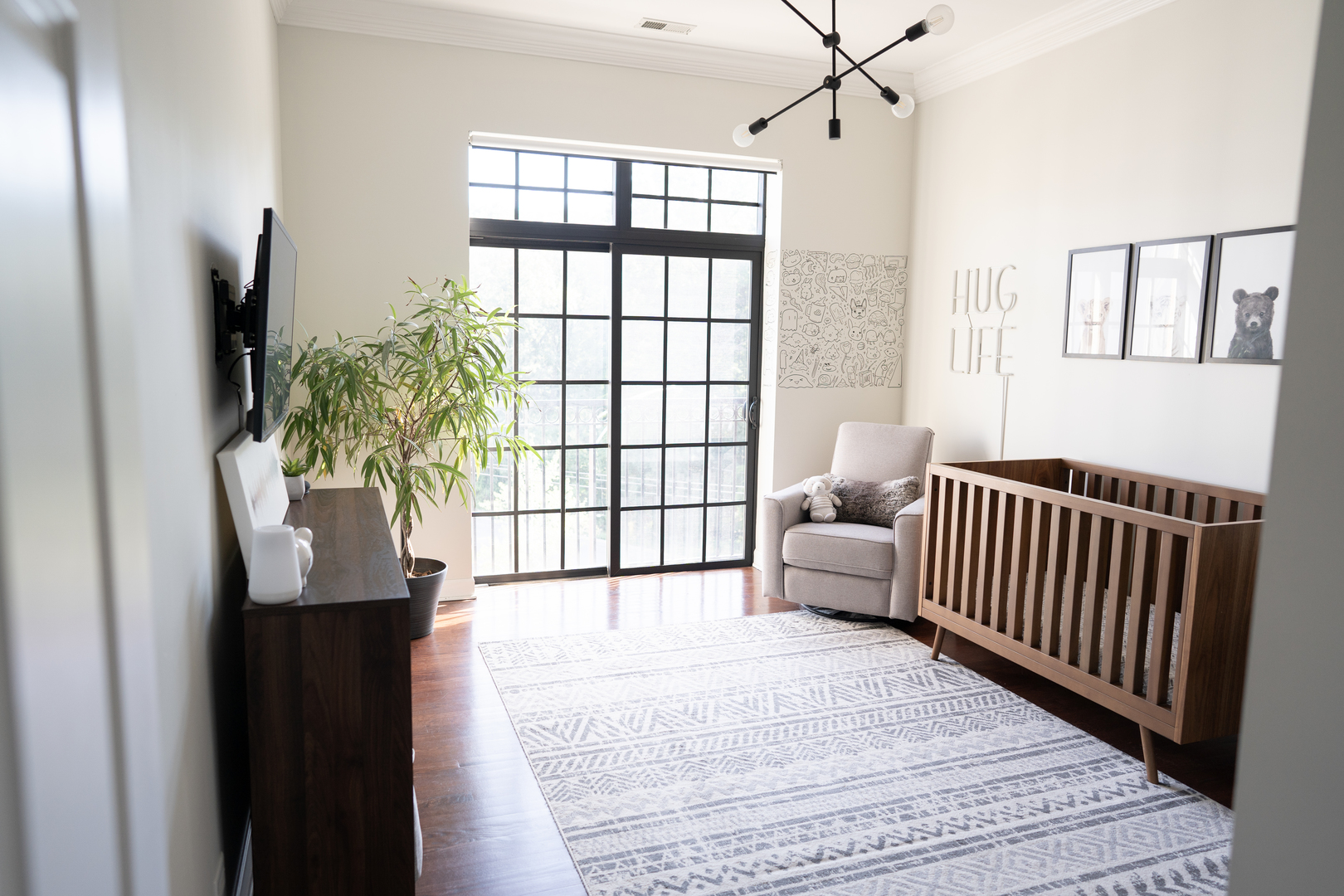 6421 West Touhy Avenue, Unit 4B Chicago, IL 60646 - Photo 14 of 24 a living room with furniture and a flat screen tv
