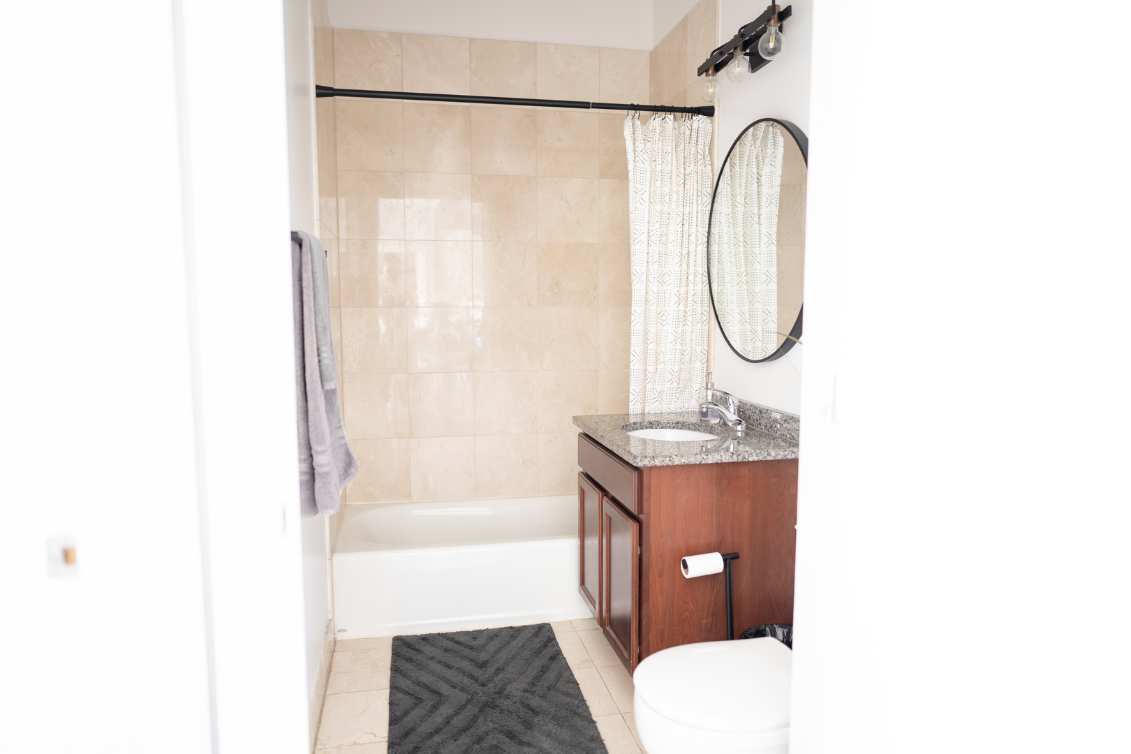 6421 West Touhy Avenue, Unit 4B Chicago, IL 60646 - Photo 19 of 24 a bathroom with a sink toilet and shower