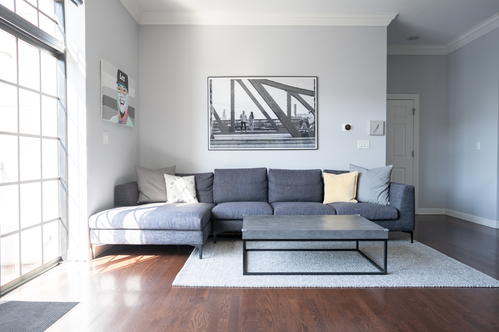 6421 West Touhy Avenue, Unit 4B Chicago, IL 60646 - Photo 3 of 24 a living room with furniture and a large window