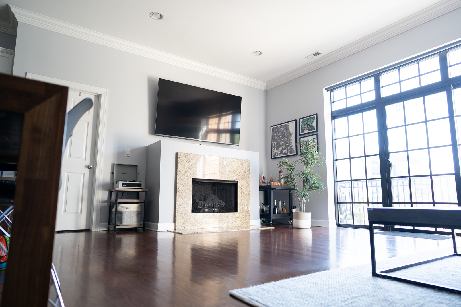 6421 West Touhy Avenue, Unit 4B Chicago, IL 60646 - Photo 4 of 24 a living room with furniture fireplace and flat screen tv