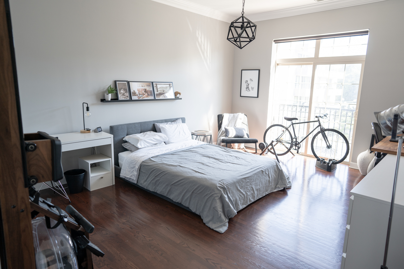 6421 West Touhy Avenue, Unit 4B Chicago, IL 60646 - Photo 8 of 24 a bedroom with a bed and dresser with wooden floor