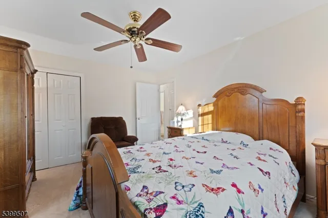 a bedroom with a bed and dresser