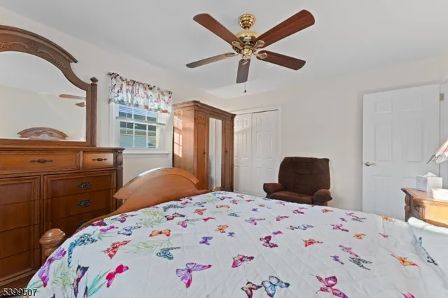 a bedroom with a large bed and a dresser