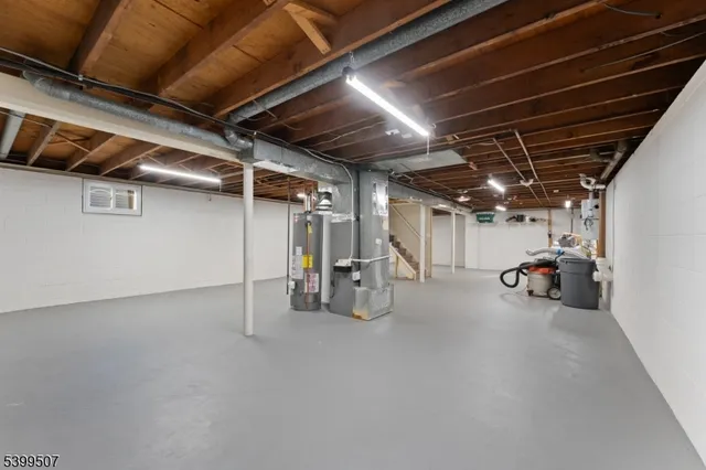 a view of empty room with wooden ceiling
