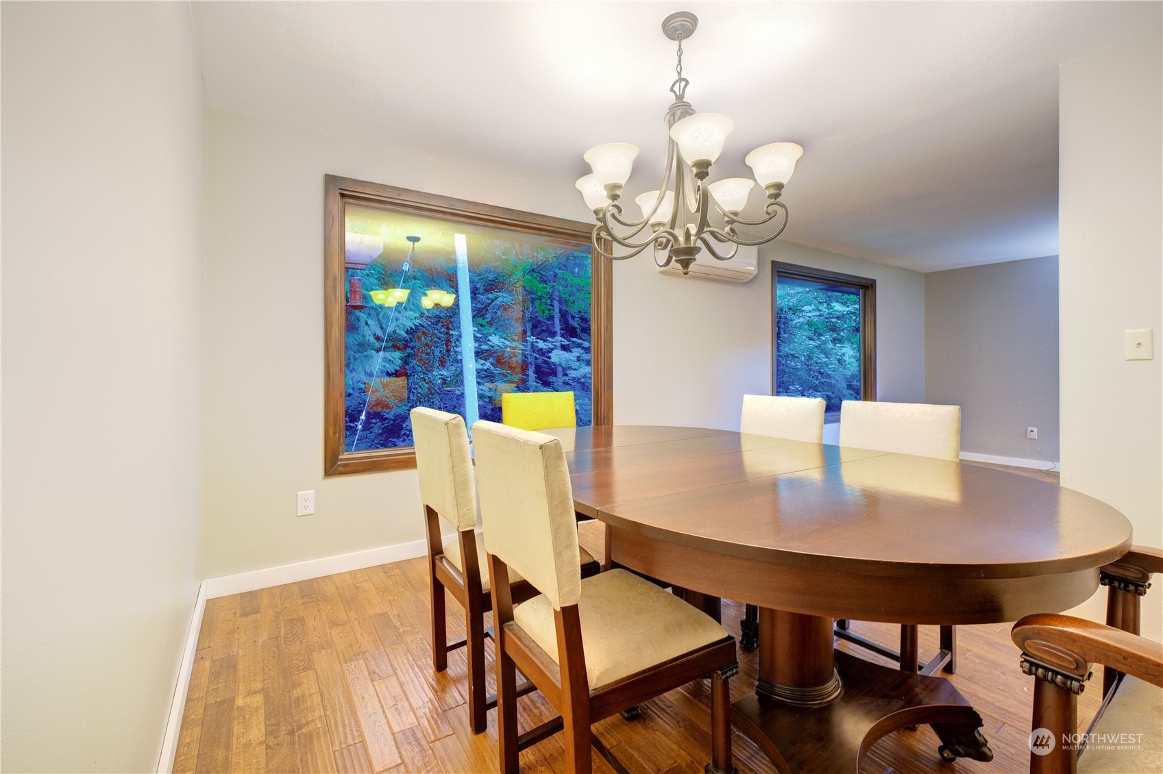 17802 Southeast Jones Road Renton, WA 98058 - Photo 11 of 38 a view of a dining room with furniture and chandelier