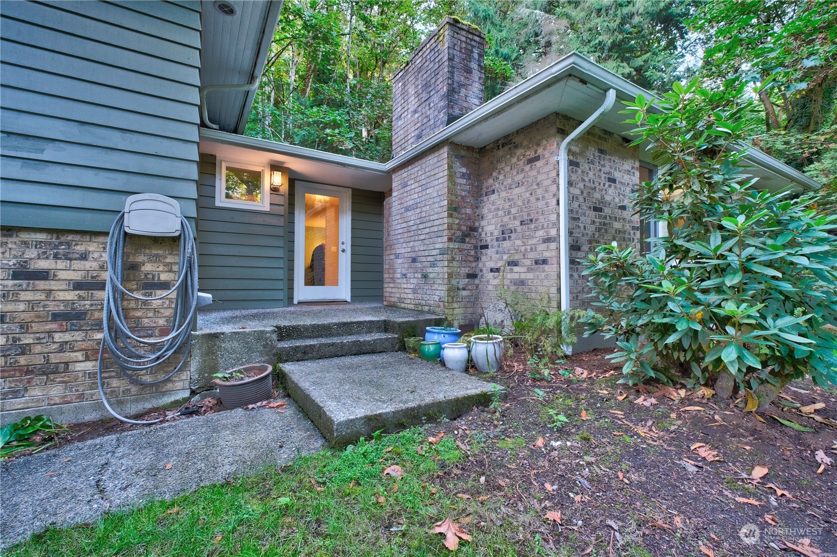 17802 Southeast Jones Road Renton, WA 98058 - Photo 15 of 38 a front view of a house with garden