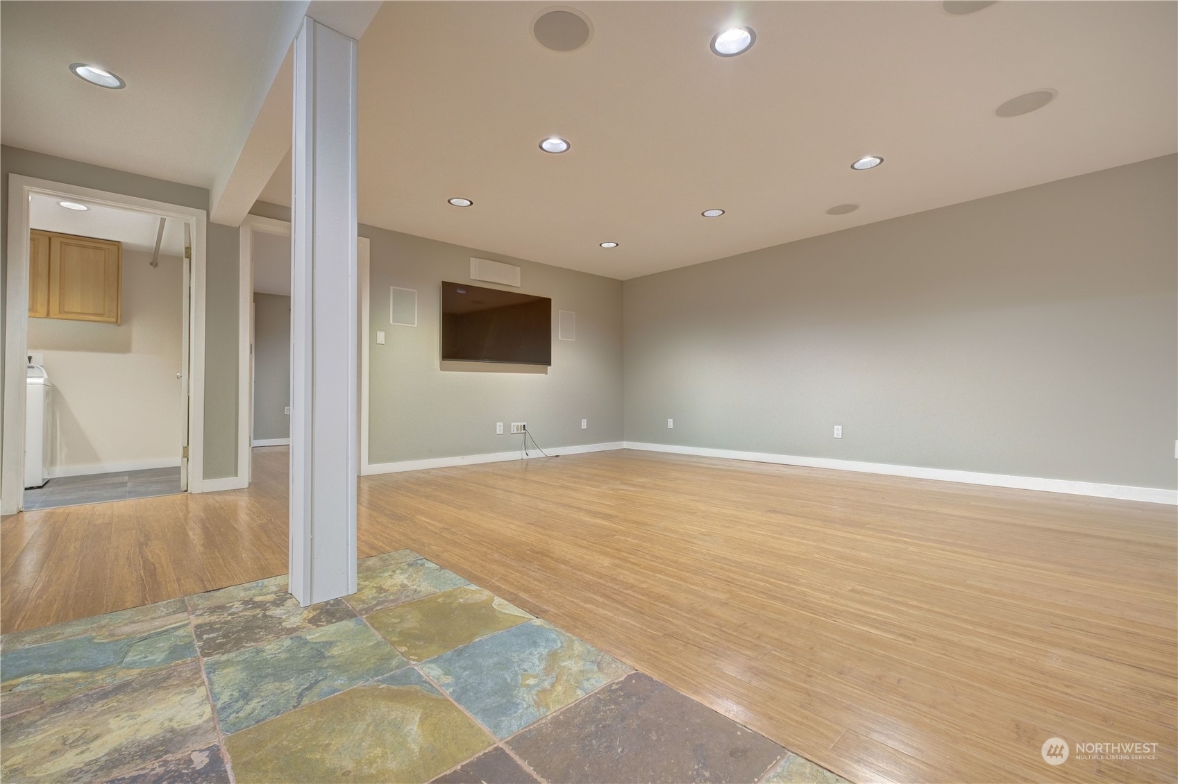 17802 Southeast Jones Road Renton, WA 98058 - Photo 18 of 38 an empty room with wooden floor and windows