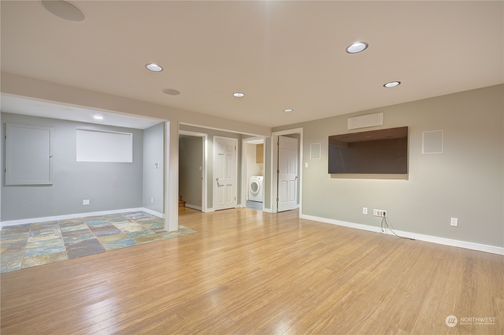 17802 Southeast Jones Road Renton, WA 98058 - Photo 19 of 38 a view of an empty room with wooden floor and windows