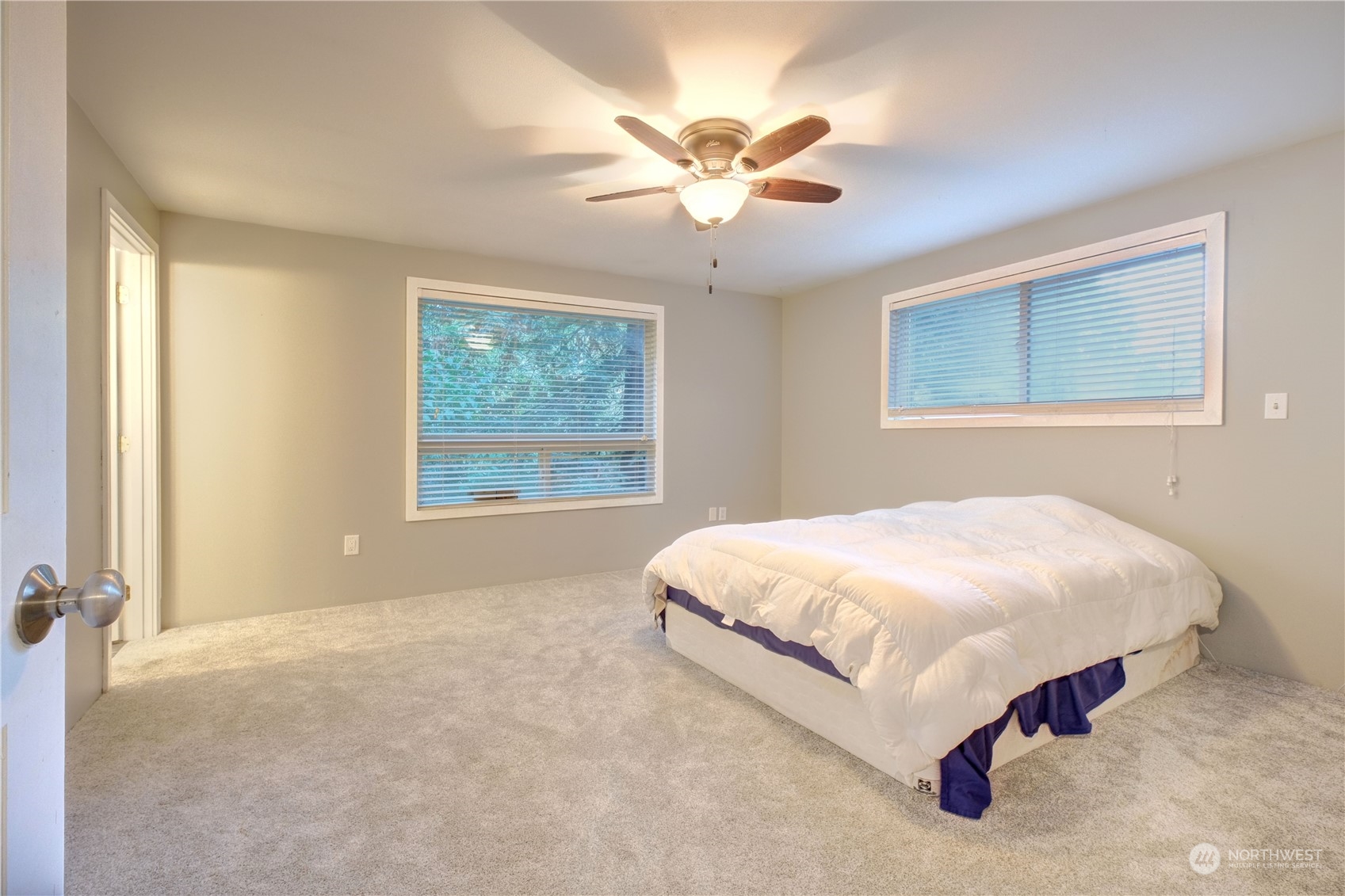 17802 Southeast Jones Road Renton, WA 98058 - Photo 20 of 38 a bed sitting in a bedroom next to a window