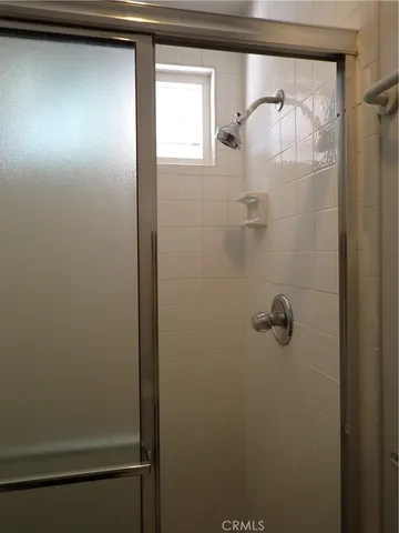 a bathroom with a sink and mirror with toilet