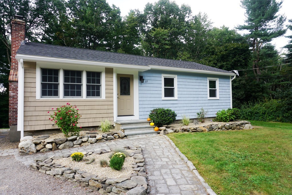 115 Harvard Road Littleton, MA 01460 - Photo 20 of 20 a front view of a house with garden