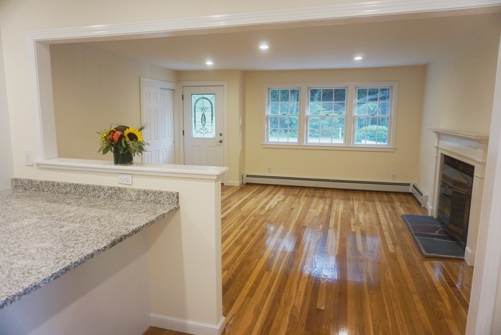 115 Harvard Road Littleton, MA 01460 - Photo 3 of 20 a view of an empty room and glass door