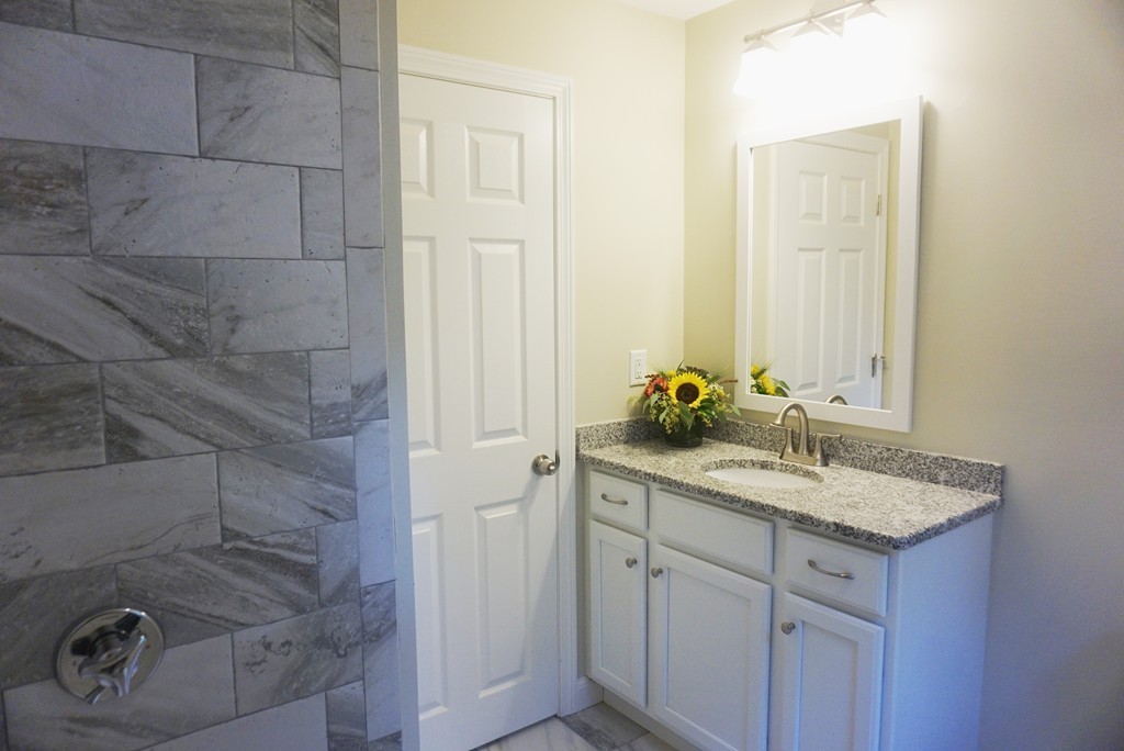 115 Harvard Road Littleton, MA 01460 - Photo 6 of 20 a bathroom with a sink and vanity