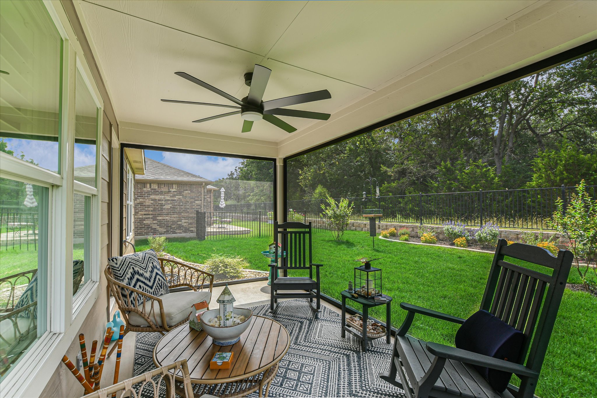 231 Hobby Street Georgetown, TX 78633 - Photo 24 of 29 Unwind in the screened-in patio, offering serene views of the fenced, landscaped yard.