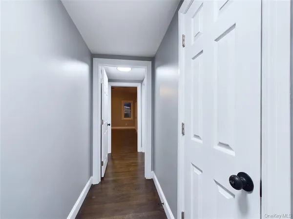 a view of a bathroom from a hallway